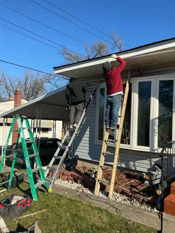 Restoration crew performing exterior repair in Topeka